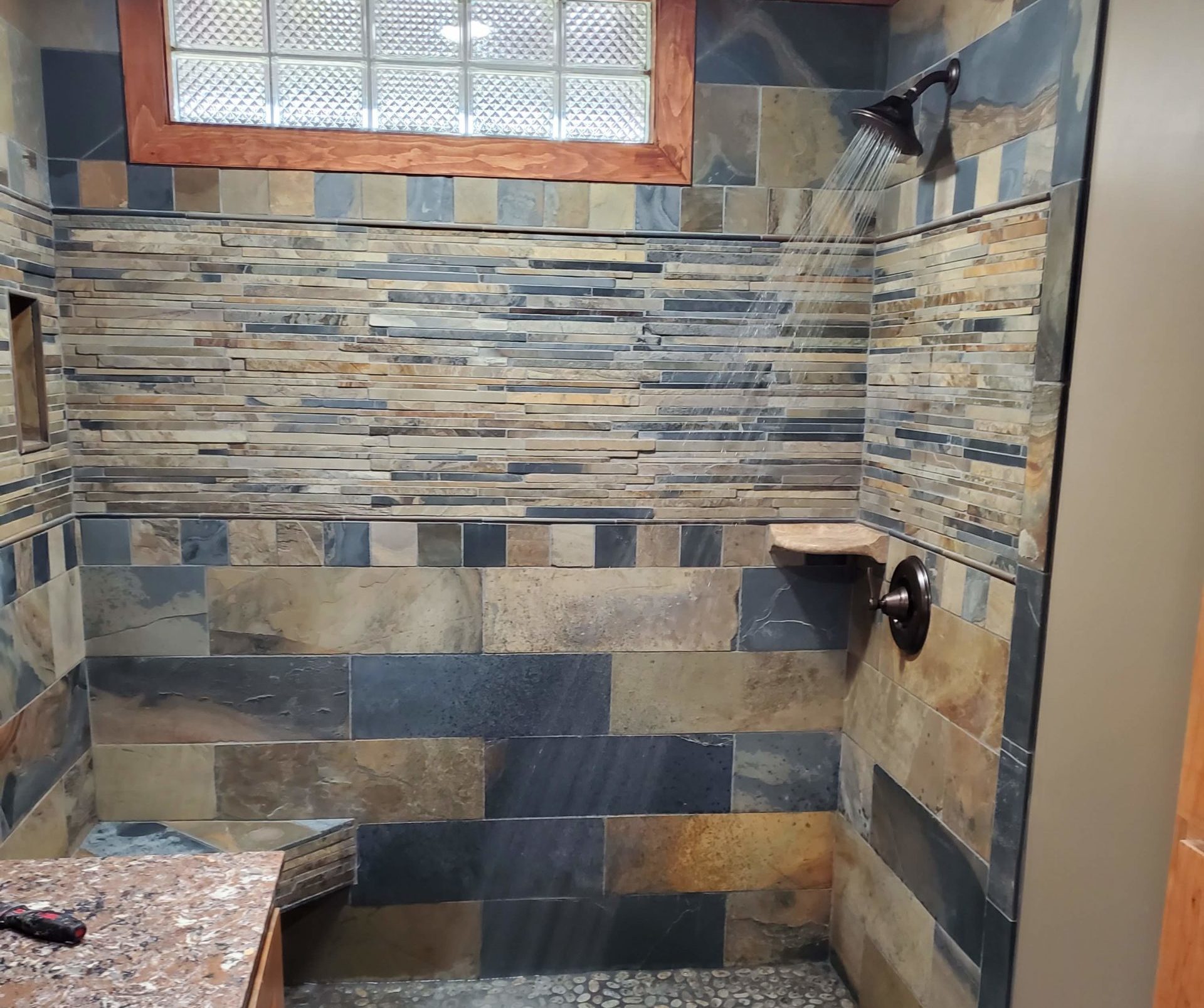 The interior of a modern bathroom with a shower box